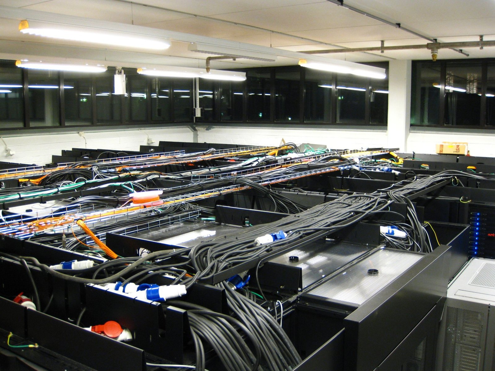 Data-centre server room representing the infrastructure behind AI systems